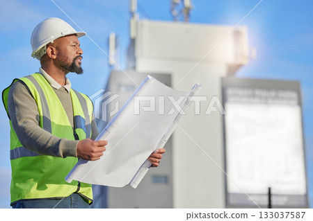 Engineering, blueprint and black man planning at construction site with paperwork. Handyman, outdoor and African male contractor working with architecture plans for building, repairs or maintenance. 133037587