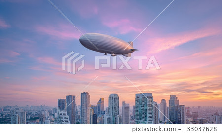 Massive silver zeppelin hovers over city skyline at sunrise, showcasing the future of public transport in vibrant pastel hues 133037628