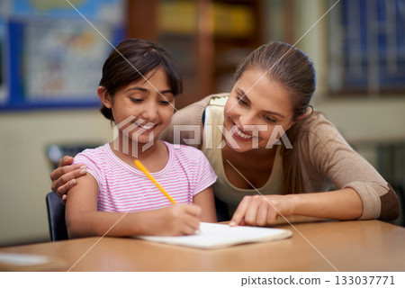 School, education or scholarship with a student and teacher in a classroom together for writing or child development. Study, learning and teaching with a woman educator helping a girl child in class 133037771
