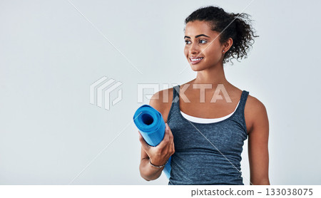 Yoga, fitness and face of woman with mat for wellness, exercise and healthy body on white background. Happy, pilates mockup and female person ready for workout for balance, wellbeing and training 133038075