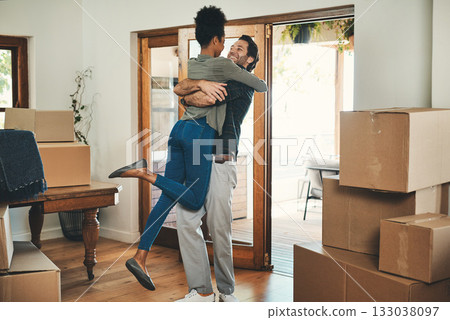 Happy couple, hug and real estate moving in new home for relocation, renovation or investment together. Interracial man hugging woman and homeowners with boxes in house for move, mortgage or property Happy couple, hug and real estate moving in new home for relocation, renovation or investment together. Interracial man hugging woman and homeowners with boxes in house for move, mortgage or property 133038097