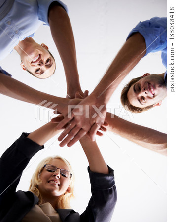 Portrait, low angle and happy people with hand huddle in support, faq and target of success, business goals or trust. Motivation, hands and group collaboration of teamwork, synergy and victory circle Portrait, low angle and happy people with hand huddle in support, faq and target of success, business goals or trust. Motivation, hands and group collaboration of teamwork, synergy and victory circle 133038418