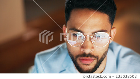 Business man, reading online and glasses reflection for night coding, programming and software development or solution. Young IT professional or programmer problem solving at a startup tech company 133038508
