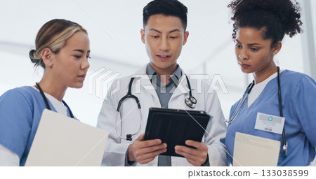 Doctors, nurse and meeting with tablet in hospital for healthcare review, telehealth analysis or support in clinic. Medical team, asian surgeon and discussion on digital tech for planning information 133038599