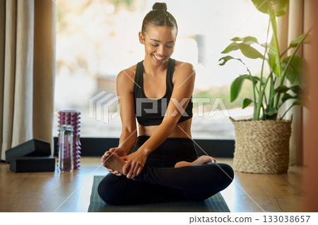 Flexible, yoga and woman relax on a floor for wellness, training and morning cardio in her home. Meditation, lotus pose and girl practice flexibility, balance and posture on a mat, happy and smile 133038657