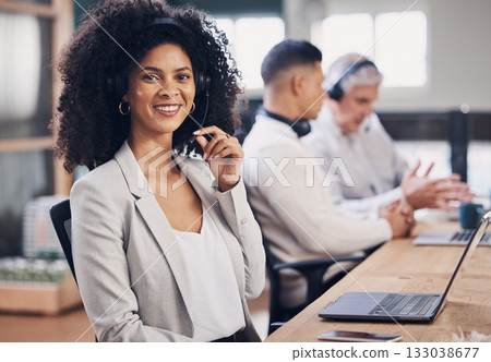 Portrait, call center and customer service with a black woman consulting in her telesales office for work. Contact us, support and telemarketing with a female employee or consultant using a headset Portrait, call center and customer service with a black woman consulting in her telesales office for work. Contact us, support and telemarketing with a female employee or consultant using a headset 133038677