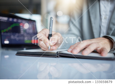 Trader, hands and writing notes in book on stock market chart or graph statistics for trading at the office. Hand of investor or broker taking note of bitcoin, cryptocurrency or investment for profit Trader, hands and writing notes in book on stock market chart or graph statistics for trading at the office. Hand of investor or broker taking note of bitcoin, cryptocurrency or investment for profit 133038679