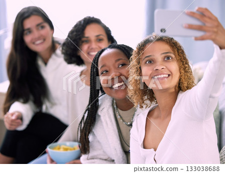 Woman, friends and smile for selfie, profile picture or vlog together relaxing on living room sofa at home. Happy women smiling for photo, memory or online social media post in friendship indoors Woman, friends and smile for selfie, profile picture or vlog together relaxing on living room sofa at home. Happy women smiling for photo, memory or online social media post in friendship indoors 133038688