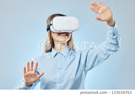 Future, woman and virtual reality glasses for online planning and innovation against a blue studio background. Female employee, lady or consultant with vr, eyewear and futuristic with happiness Future, woman and virtual reality glasses for online planning and innovation against a blue studio background. Female employee, lady or consultant with vr, eyewear and futuristic with happiness 133038763