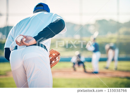 Man, baseball and pitcher ready to throw ball for game, match or victory shot on grass field at pitch. Male sports player with hand behind back with mitt in preparation for sport pitching outdoors Man, baseball and pitcher ready to throw ball for game, match or victory shot on grass field at pitch. Male sports player with hand behind back with mitt in preparation for sport pitching outdoors 133038766