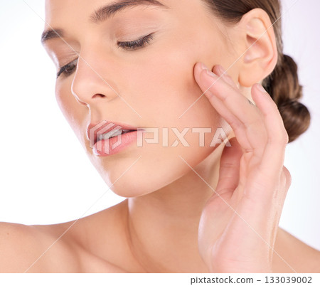 Face, hand or woman with skincare or dermatology product in grooming treatment with natural makeup cosmetics. Beauty, mockup space background or girl model applying luxury facial skincare in studio 133039002