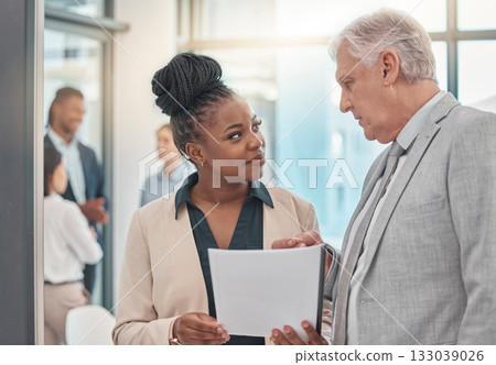 Documents, discussion and man and black woman talking in office for business proposal, strategy or advice. Collaboration, teamwork and corporate managers meeting for project, report or finance review Documents, discussion and man and black woman talking in office for business proposal, strategy or advice. Collaboration, teamwork and corporate managers meeting for project, report or finance review 133039026