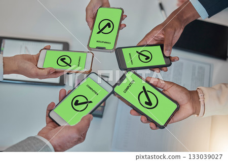 Business people, hands and phone with tick in networking, teamwork planning or sharing information. Hand of group above showing smartphone display in completion for tasks, mobile app or data syncing Business people, hands and phone with tick in networking, teamwork planning or sharing information. Hand of group above showing smartphone display in completion for tasks, mobile app or data syncing 133039027
