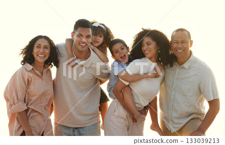 Sunset, big family and portrait smile at beach, having fun and smiling on vacation outdoors. Care, bonding and happy kids, grandmother and grandfather with parents laughing and enjoying holiday time. 133039213