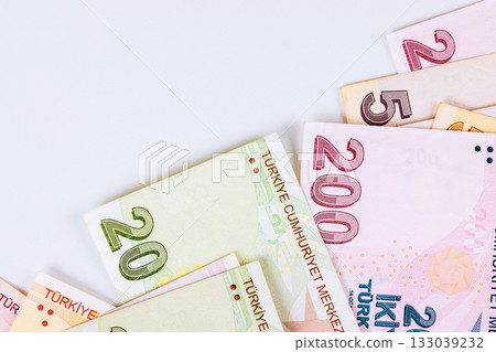 Currency denominations of Turkish lira laid out on light background showcasing various banknotes 133039232