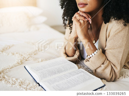 Bible, prayer and hands praying for hope, religion or help, spiritual or faith in home. God, christian and female or woman worship Jesus Christ or Holy Spirit with catholic text or book for peace. Bible, prayer and hands praying for hope, religion or help, spiritual or faith in home. God, christian and female or woman worship Jesus Christ or Holy Spirit with catholic text or book for peace. 133039265