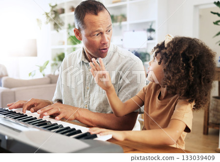 Piano, learning and girl with grandfather in home, playing or bonding together. Wow surprise, education and shocked grandpa teaching kid how to play musical instrument, acoustic and electric keyboard 133039409