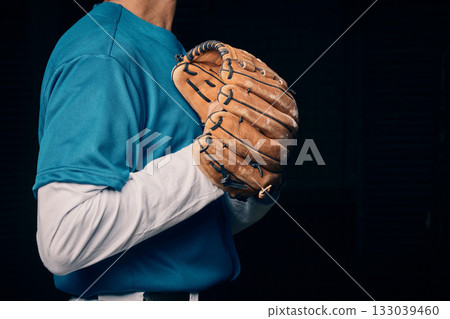 Baseball pitcher, hand and glove in studio for sport, training and throwing by black background. Man, cropped and hands for exercise, strikeout or athlete with sports, game or competition for workout Baseball pitcher, hand and glove in studio for sport, training and throwing by black background. Man, cropped and hands for exercise, strikeout or athlete with sports, game or competition for workout 133039460