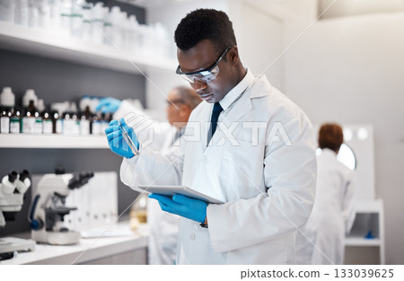 Science, research and black man in laboratory with tablet for medical analysis and digital innovation in medicine. Pharmaceutical analytics, web and scientist in South Africa checking results online. Science, research and black man in laboratory with tablet for medical analysis and digital innovation in medicine. Pharmaceutical analytics, web and scientist in South Africa checking results online. 133039625