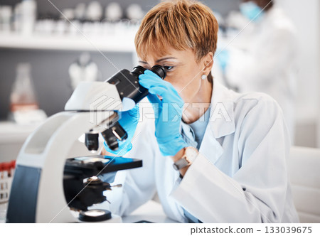 Medical, microscope and science with black woman in laboratory for experiment, research and pharmacy. Healthcare, medicine and results with expert looking for pathology, test and sample analysis 133039675