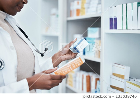 Black woman, pharmacy and choice with box, medicine and decision with prescription for healthcare. Pharmacist, drugs and pharmaceutical pills for health, wellness or medical store with stock on shelf 133039740
