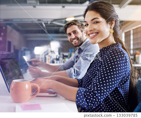 Office, smile and portrait of man and woman at desk with laptop at creative agency, working on project together. Leadership, partnership and happy employees or business partner at design startup. 133039785