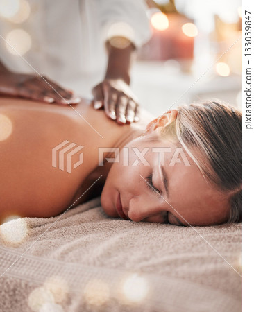 Woman, back massage at spa and holistic therapy with masseuse hands, wellness and treatment with zen. Health, peace of mind and stress relief, self care and lifestyle with healing, face and calm Woman, back massage at spa and holistic therapy with masseuse hands, wellness and treatment with zen. Health, peace of mind and stress relief, self care and lifestyle with healing, face and calm 133039847