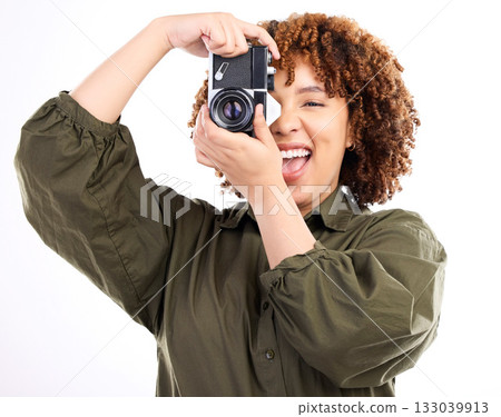 Fun, photo and portrait of a black woman with a camera isolated on a white background in a studio. Excited, professional and photographer filming, shooting and being paparazzi with equipment Fun, photo and portrait of a black woman with a camera isolated on a white background in a studio. Excited, professional and photographer filming, shooting and being paparazzi with equipment 133039913
