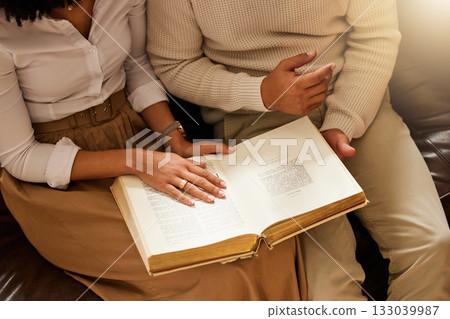 Bible, hands and reading with a black couple together in their home for religion, faith or belief in God. Jesus, pray or book with a christian man and woman learning about the spiritual christ Bible, hands and reading with a black couple together in their home for religion, faith or belief in God. Jesus, pray or book with a christian man and woman learning about the spiritual christ 133039987