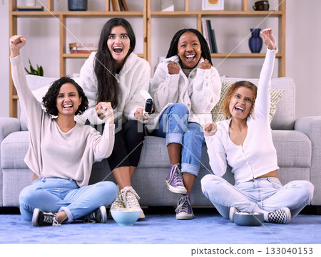 Excited, friends and women in lounge, video game and quality time with achievement, cheerful and happiness. Female gamers, group and ladies with console, celebration and joyful for victory and gaming 133040153