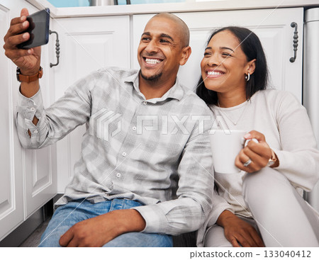 Selfie, black couple and morning in a kitchen happy about new real estate and property purchase. House, smile and happiness of young people together taking a social media profile photo for web app Selfie, black couple and morning in a kitchen happy about new real estate and property purchase. House, smile and happiness of young people together taking a social media profile photo for web app 133040412