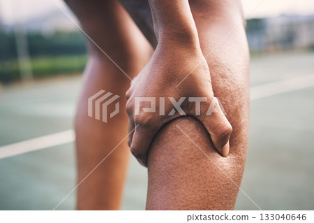 Knee injury, fitness pain and netball athlete on a outdoor sports court with joint or muscle problem. Training, exercise and black woman hands holding legs with muscle and wellness issue from game Knee injury, fitness pain and netball athlete on a outdoor sports court with joint or muscle problem. Training, exercise and black woman hands holding legs with muscle and wellness issue from game 133040646