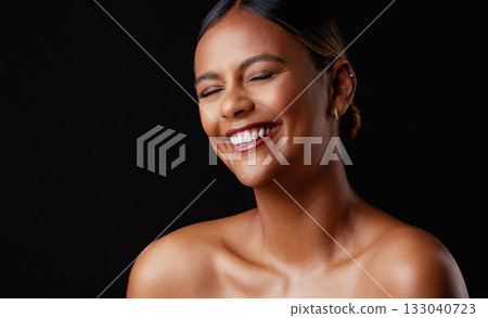 Skincare, funny and black woman with smile, dermatology and joyful against dark studio background. Cosmetics, African American female and lady with happiness, laughing and wellness with shine or glow 133040723