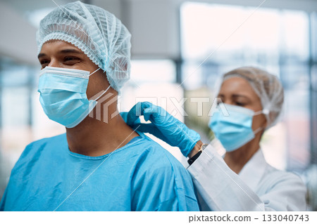 Surgeon team, doctors and surgery with face mask and health, help with ppe for safety, operation and ready for procedure. Cardiovascular, clean scrubs and people in clinic with physician partnership 133040743