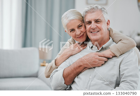 Portrait, love and mockup with a senior couple hugging in the living room of their house together. Smile, space or trust with a happy mature man and woman bonding while enjoying retirement at home 133040790