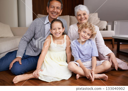 Portrait, floor or happy grandparents with kids sit smiling together in family home in retirement. Senior grandma, smile or children siblings relaxing or bonding to enjoy quality time with old man 133040902