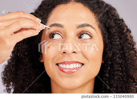 Eyebrow grooming, face tweezer and black woman with wellness, dermatology and facial hair cleaning. Skincare, epilation and clean beauty routine of a young model in a studio doing skin pore removal Eyebrow grooming, face tweezer and black woman with wellness, dermatology and facial hair cleaning. Skincare, epilation and clean beauty routine of a young model in a studio doing skin pore removal 133040980