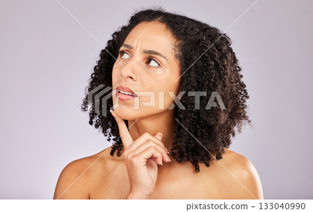 Black woman, thinking and skincare in studio with idea, confused and brainstorming with beauty. Young gen z model, healthy skin glow and ideas with girl focus, vision and wellness by gray background Black woman, thinking and skincare in studio with idea, confused and brainstorming with beauty. Young gen z model, healthy skin glow and ideas with girl focus, vision and wellness by gray background 133040990