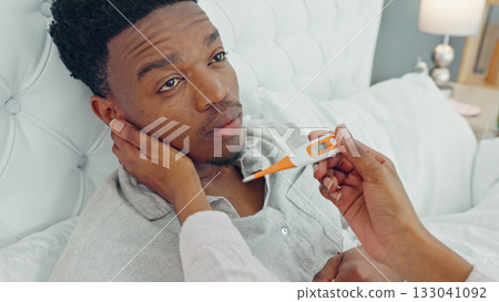 Thermometer, sick and couple in a bedroom for care with husband in bed for illness, flu or virus and resting at home. Love, medical and woman support partner or tired man with medical cold or fever Thermometer, sick and couple in a bedroom for care with husband in bed for illness, flu or virus and resting at home. Love, medical and woman support partner or tired man with medical cold or fever 133041092
