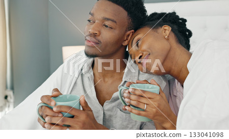 Love, couple and coffee in the morning for relax, happiness and care while looking at view from bedroom of home. .Romance, black woman and man in room embrace for commitment and healthy marriage Love, couple and coffee in the morning for relax, happiness and care while looking at view from bedroom of home. .Romance, black woman and man in room embrace for commitment and healthy marriage 133041098