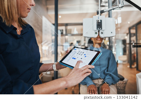 Eye exam tablet, doctor software and consulting optometrist with woman patient at clinic. Eyes wellness, healthcare and vision test with tech and digital results from glaucoma consultation machine Eye exam tablet, doctor software and consulting optometrist with woman patient at clinic. Eyes wellness, healthcare and vision test with tech and digital results from glaucoma consultation machine 133041142