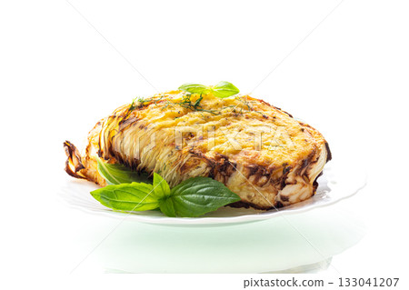 Hot baked cabbage served on a baking sheet on a white background Hot baked cabbage served on a baking sheet on a white background 133041207