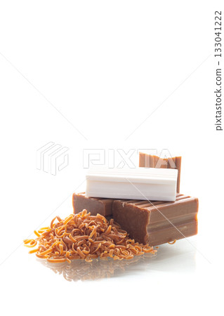 Natural brown and white cleaning soap used for washing clothes 133041222