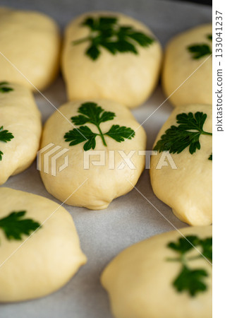 Soft dough preparation for homemade bread with fresh parsley 133041237