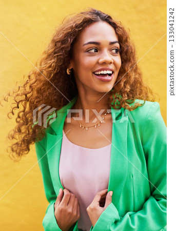 Happy, smile and fashion with black woman in city for freedom, beauty and glow. Cosmetics, confidence and youth with girl and yellow urban wall background for happiness, satisfaction and style 133041242
