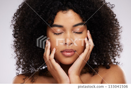 Skincare, beauty and black woman with eyes closed and hand on face, afro and advertising luxury makeup product. Dermatology, cosmetics and facial promo, skin care model isolated on studio background. Skincare, beauty and black woman with eyes closed and hand on face, afro and advertising luxury makeup product. Dermatology, cosmetics and facial promo, skin care model isolated on studio background. 133041506