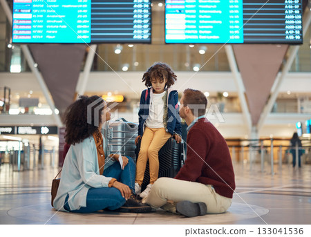 Family at airport, travel and wait with luggage, mother and father comfort sad child with flight delay and adventure. Terminal, journey and holiday with black woman, man with kid and interracial 133041536