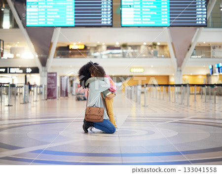 Mother hug child at airport for travel journey, welcome home reunion or goodbye, immigration and international opportunity. Black family mom and girl or kid hugging and sad for flight voyage in lobby Mother hug child at airport for travel journey, welcome home reunion or goodbye, immigration and international opportunity. Black family mom and girl or kid hugging and sad for flight voyage in lobby 133041558
