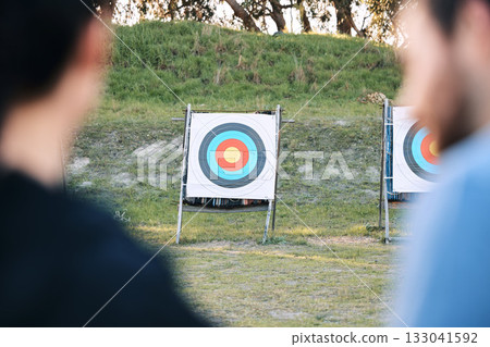 Target, archery coach or bow and arrow learning for archer competition, athlete challenge or girl training practice. Sports teacher, teaching talk or man coaching woman on precision, aim and shooting Target, archery coach or bow and arrow learning for archer competition, athlete challenge or girl training practice. Sports teacher, teaching talk or man coaching woman on precision, aim and shooting 133041592