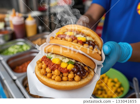 Traditional trinidadian doubles street food a spicy chickpea curry in fried bara bread 133041655